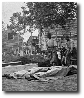 So when some Yankee officer come to the cook tent and say, hey you nigga boys got burial detail, me and the others from the colored regiment pick up our shovels and head out to the battlefield. Artwork : This photo shows four African-American men digging graves outside a hospital in Fredricksburg, Virginia, during the Civil War. It comes to us courtesy of the Library of Congress and , and is in the public domain.